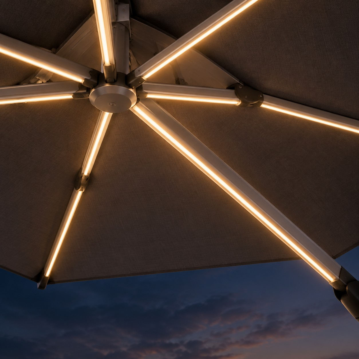 Looking up under a patio canopy at the integrated LED strips running along the inside of each aluminium rib, with no external wiring visible