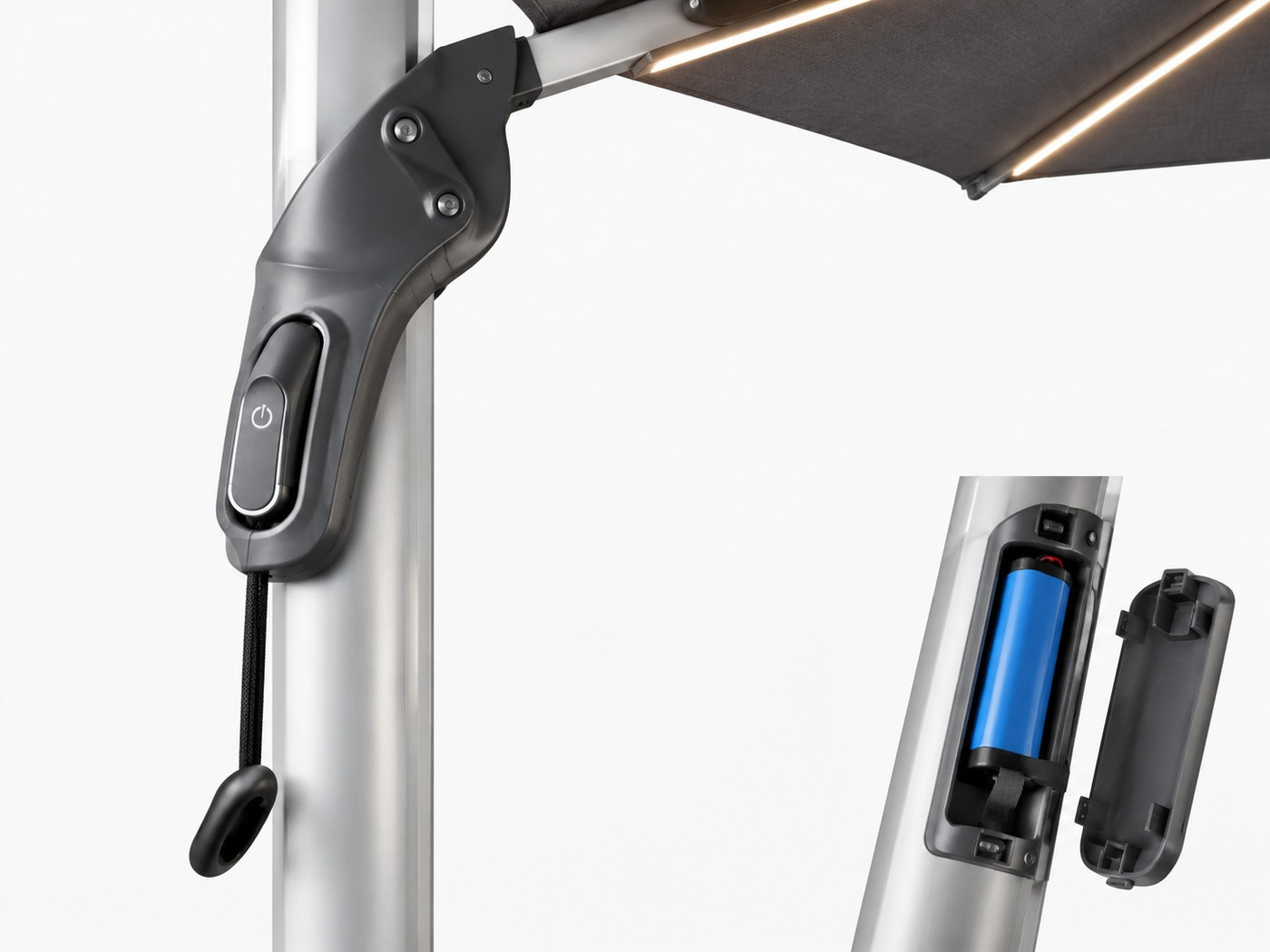 The control handle and open battery compartment on an LED umbrella pole, showing a replaceable cell and its cover