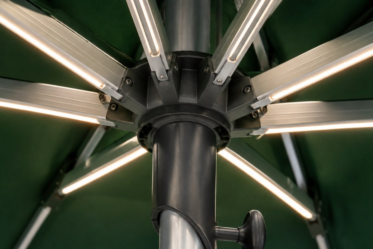 A close view of the die-cast hub where the ribs meet the pole, with each aluminium rib bolted into its own socket