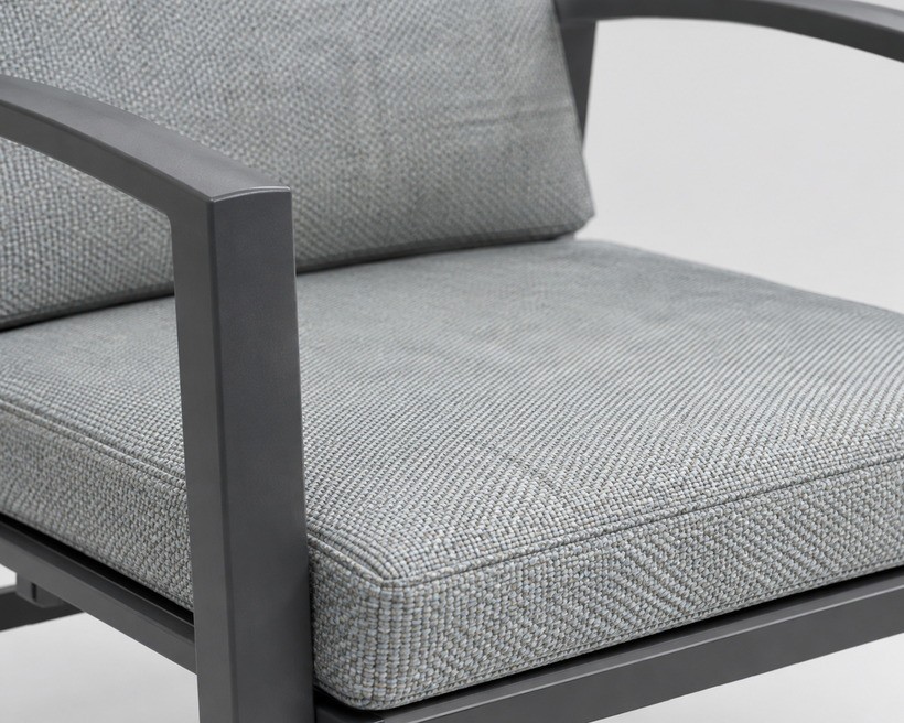 A high-back adjustable outdoor dining armchair
