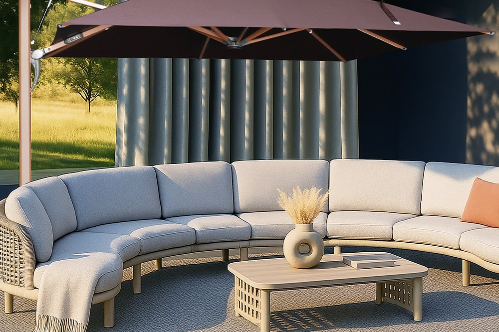 A dark cantilever umbrella with a timber frame set over a curved outdoor lounge seating group