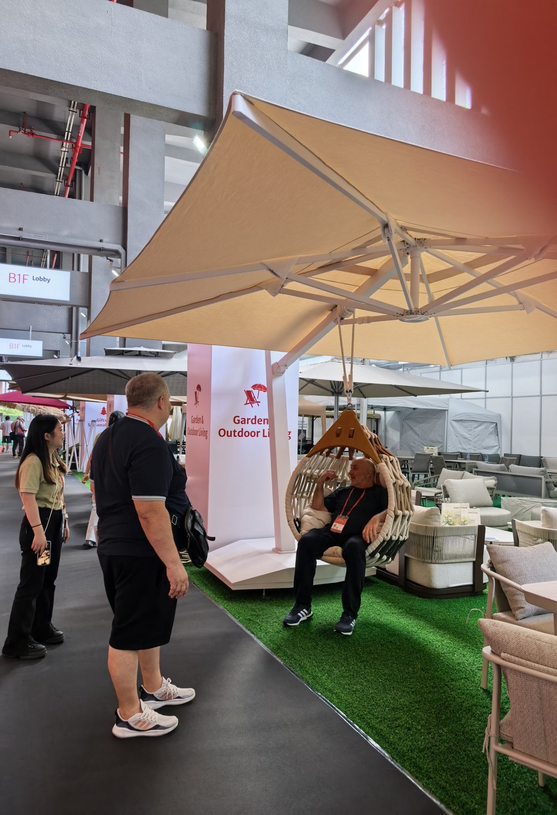 Guests testing the comfort of the hanging chair