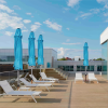 Bold Yellow Patio Umbrella with Center Pole and Bright Yellow Canopy for Stylish Poolside Lounging