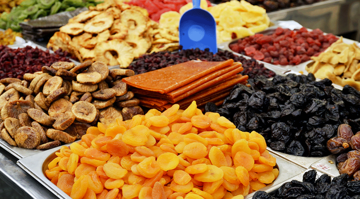 Assorted dried fruits in wooden bowls