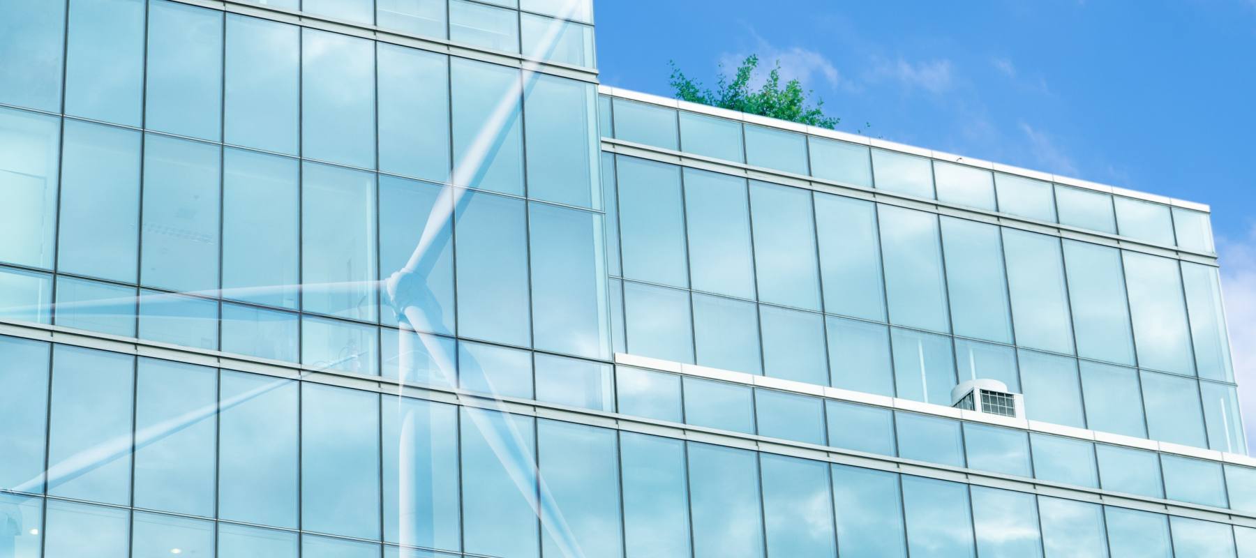 Glass curtain wall facade at dusk