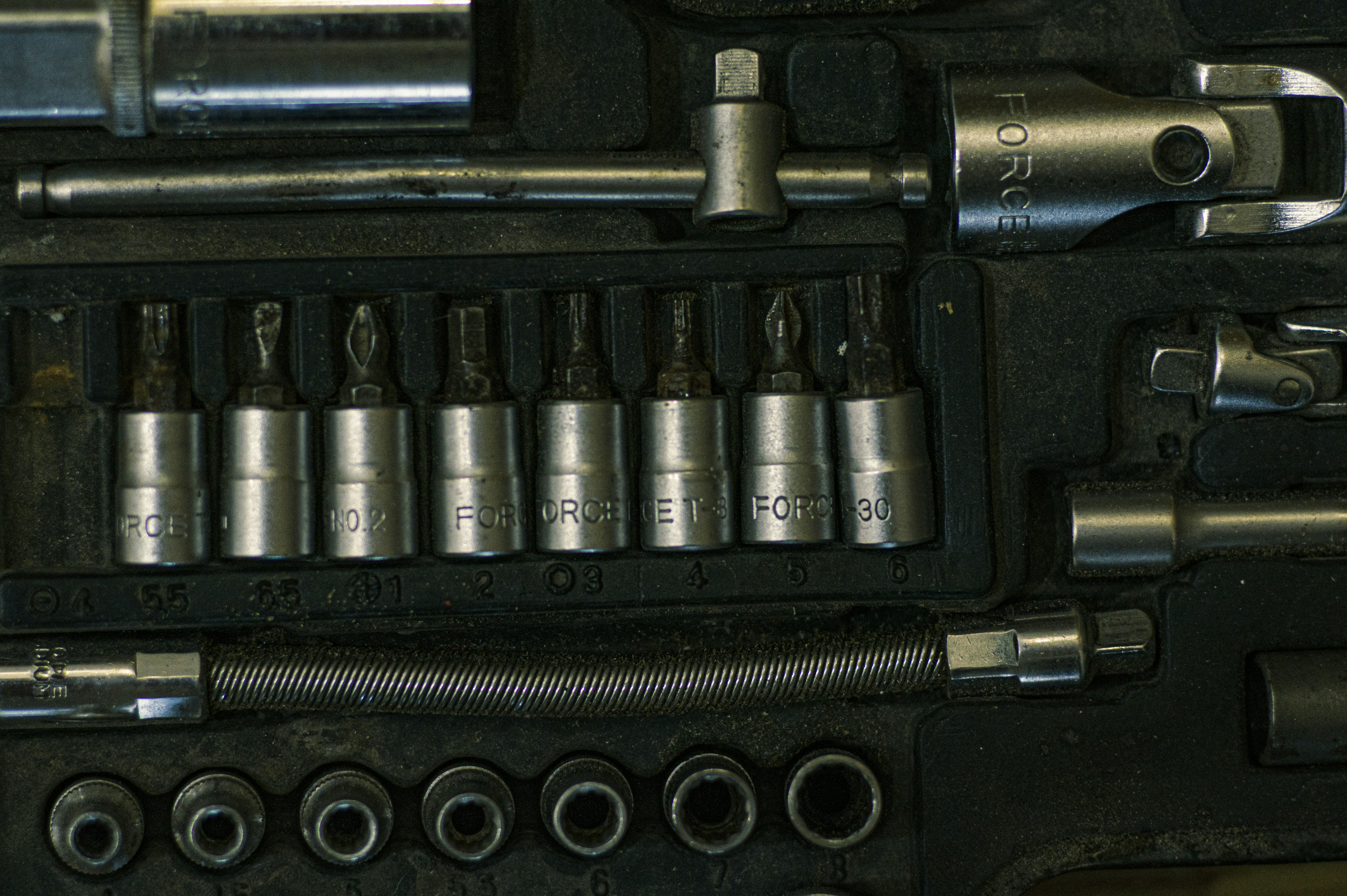 A side-by-side comparison of a locking and non-locking custom steel carabiner