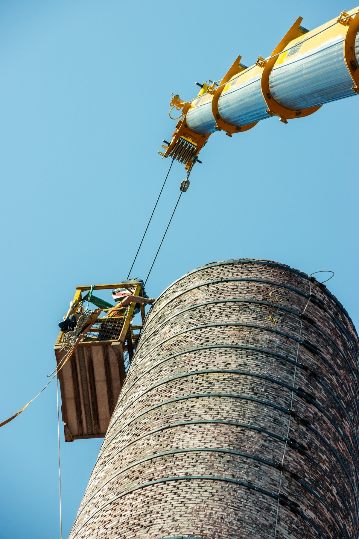 Professional rope access work using safety equipment at height