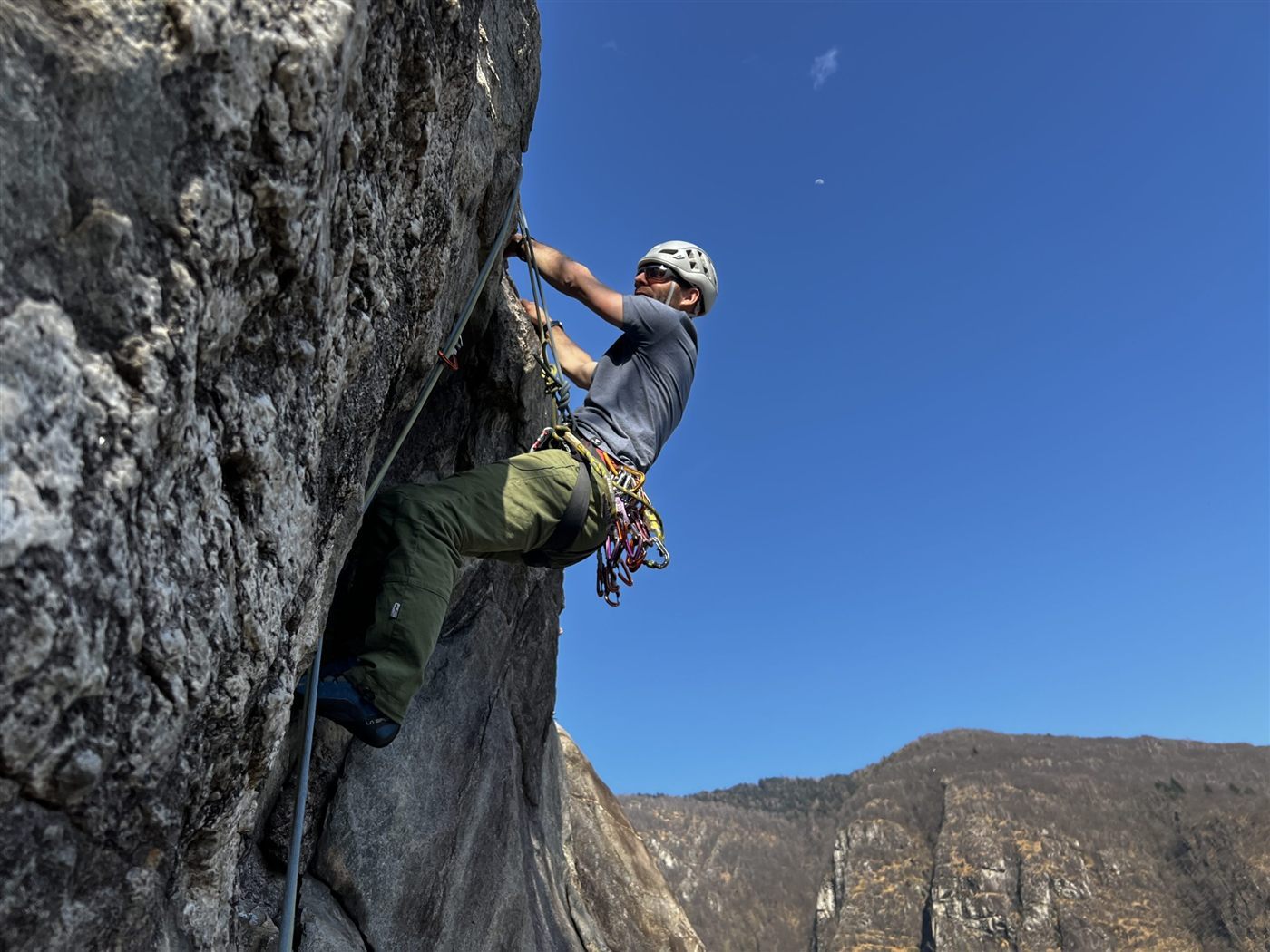 Rock climber carrying color-anodized aluminum carabiners for identification