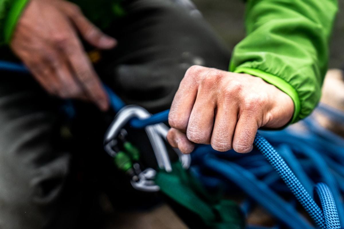 Professional wearing a safety harness