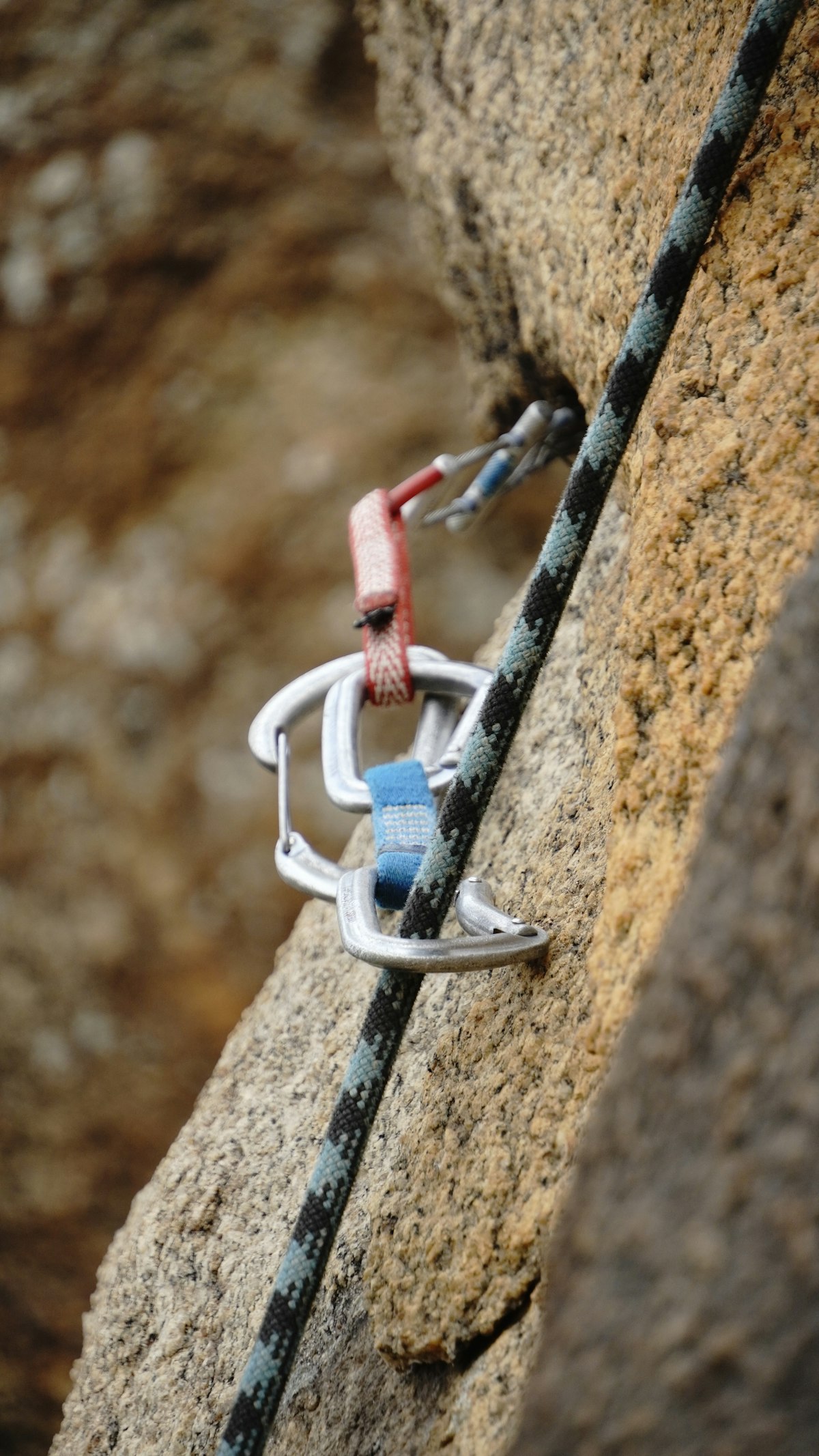 Carabiners and climbing rope in use showing why connector compatibility and correct loading matter
