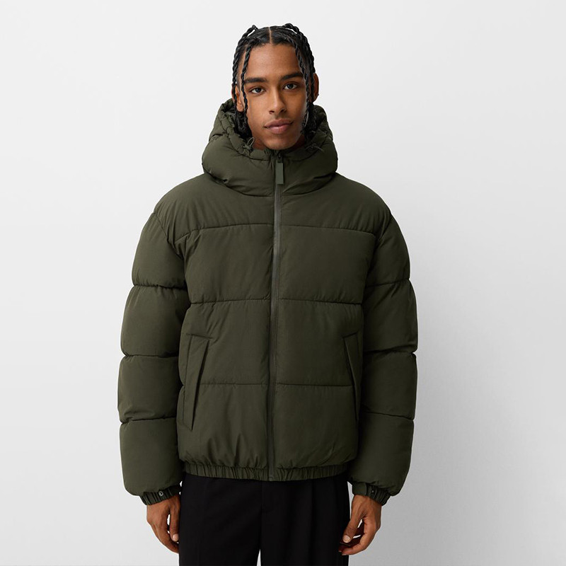 What labels and care tags are required for down jackets in the US and EU?