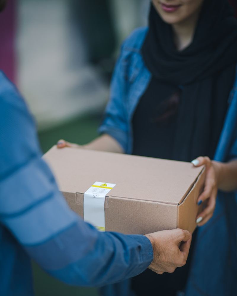 Logistics warehouse with packaged goods stacked and labeled for international shipping