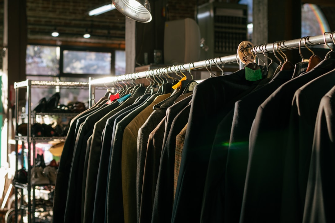 A rack of finished streetwear garments in a modern factory setting