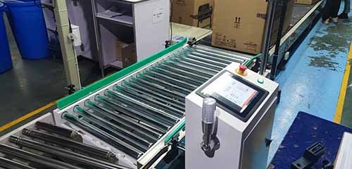 Roller Top Checkweigher to Boxed Home Appliances