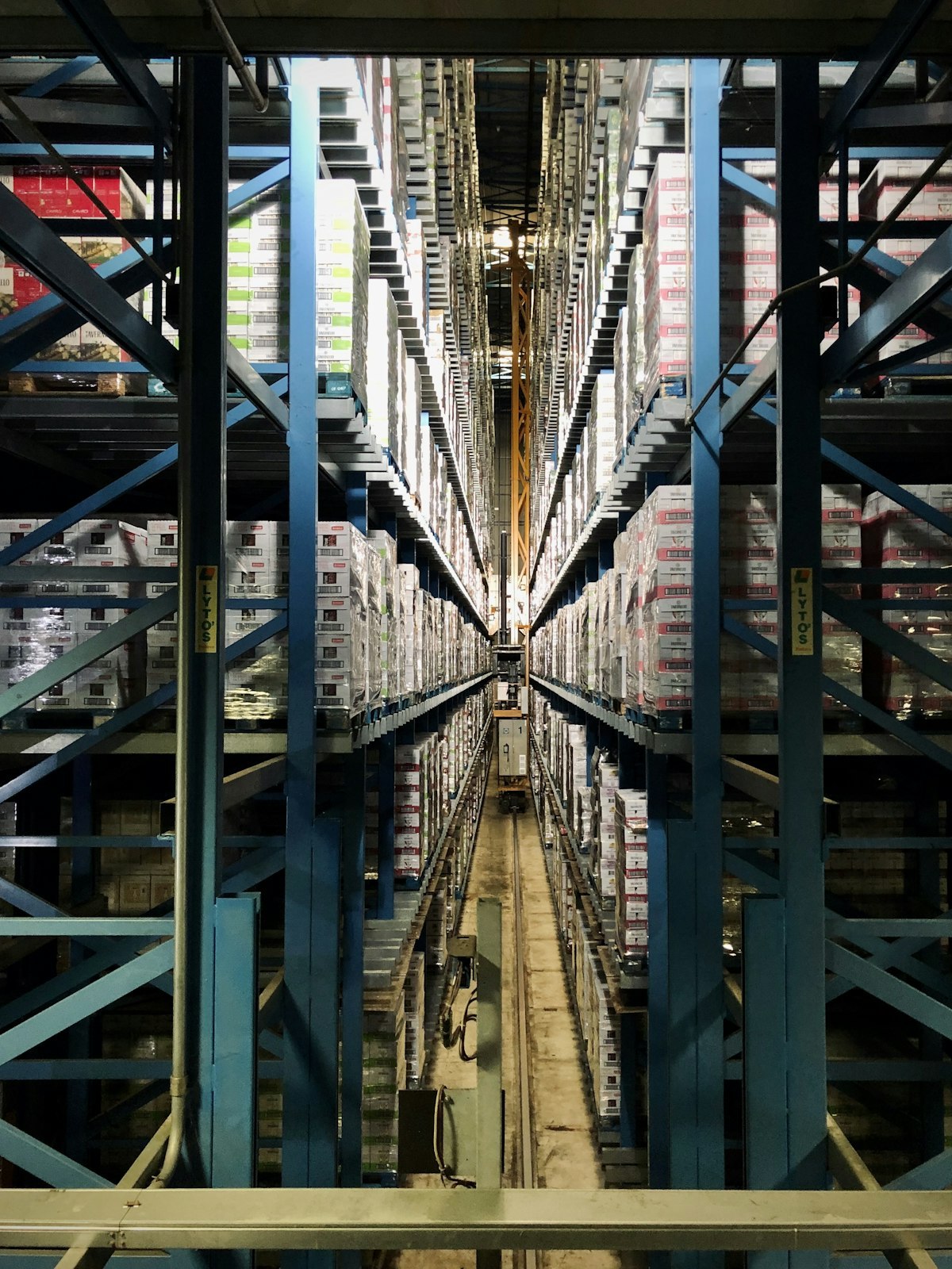 In-motion checkweigher on a packing line with its type-approval plate