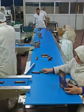 Metal detection machine inspecting chocolate