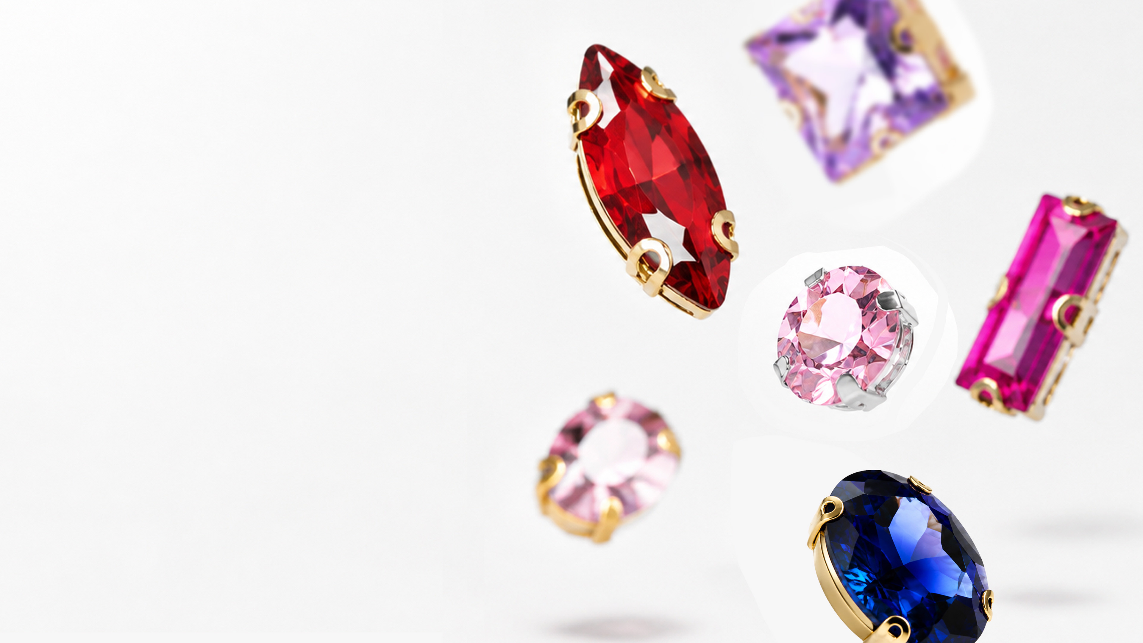 Colorful claw rhinestones arranged on a bright surface