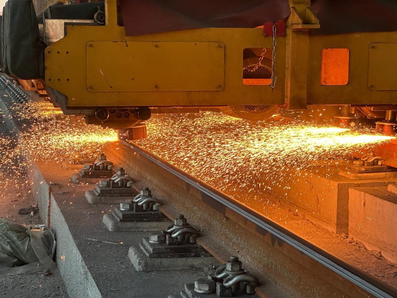 rail grinding: a grinding train working on mainline track