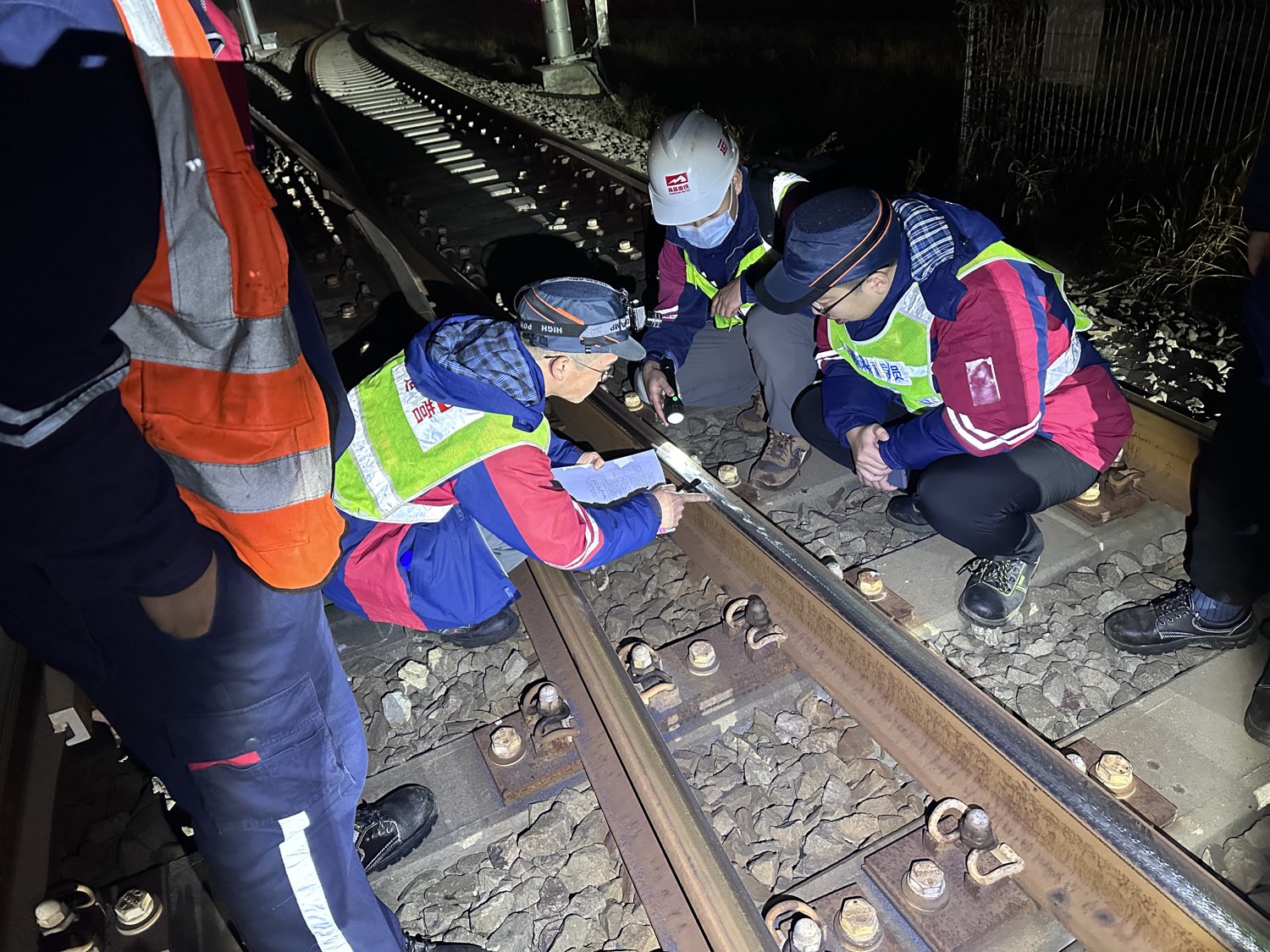 rail grinder and track crew during a maintenance possession
