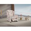 A push back reclining  in a soft, comfortable floral fabric.