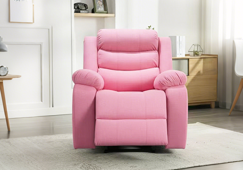 Pink kid recliner chair standing in a child's bedroom with a low cabinet and rug