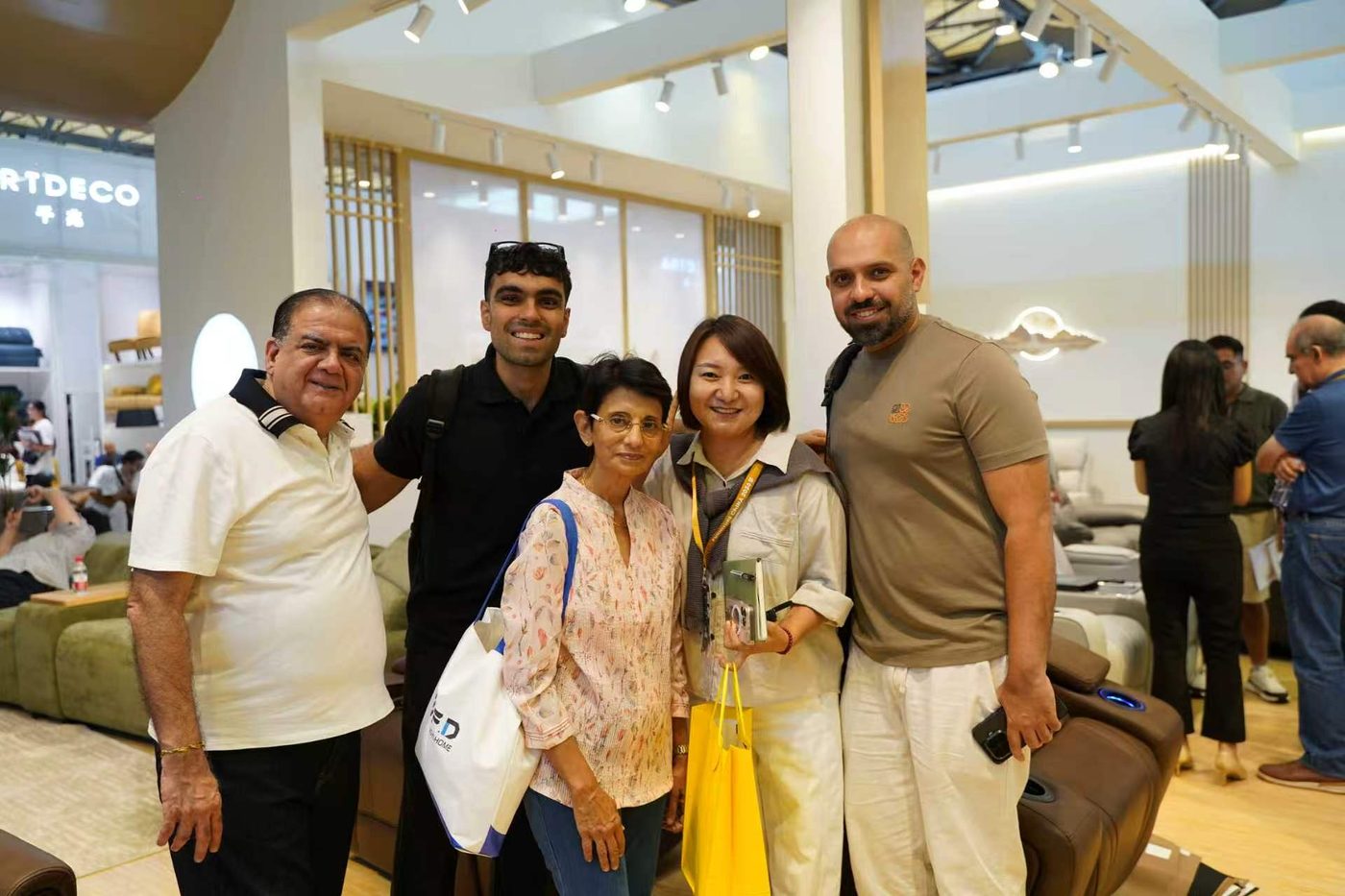 Group photo with buyers at the booth