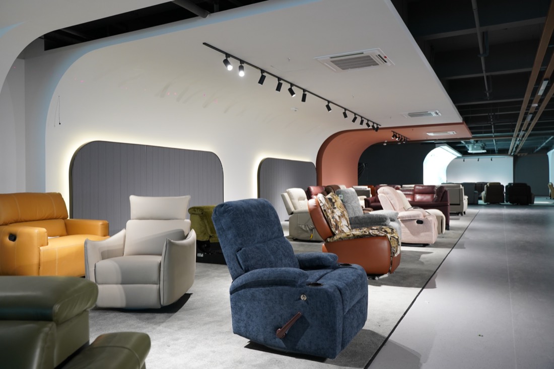 Recliner sofa showroom with multiple fabric and leather models on display