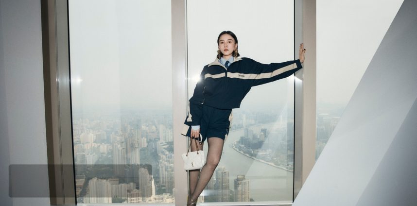 Saint Laurent Summer Mood Campaign visual — girl seated in an outdoor lifestyle setting