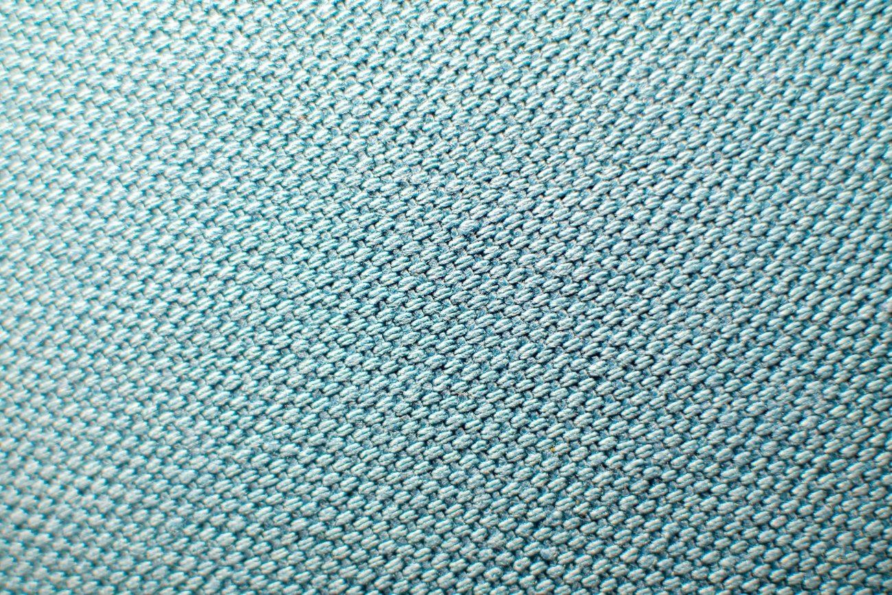 Close-up of blue and white knit textile construction