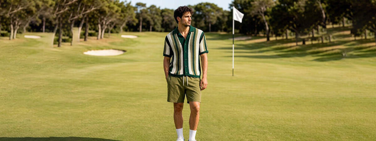 Golfer wearing premium custom polo shirt on sunny course, editorial lifestyle shot