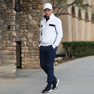 Yacht club member in weatherproof jacket at marina