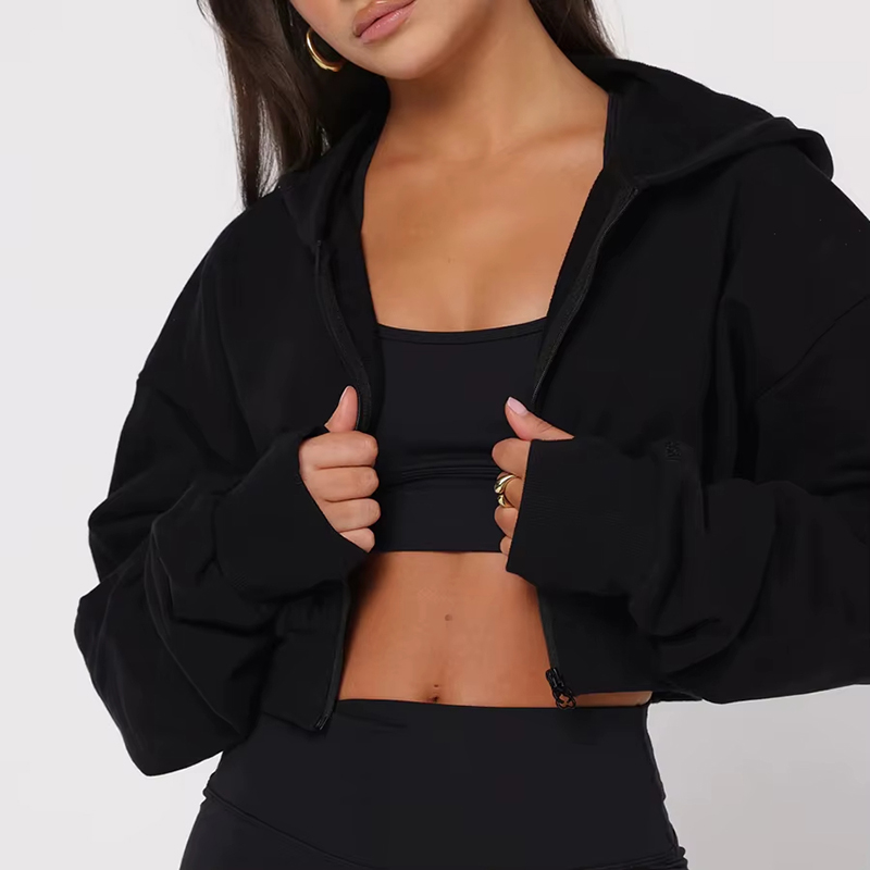 Loose-fit drop-shoulder cropped full-zip soft jacket in black worn by model