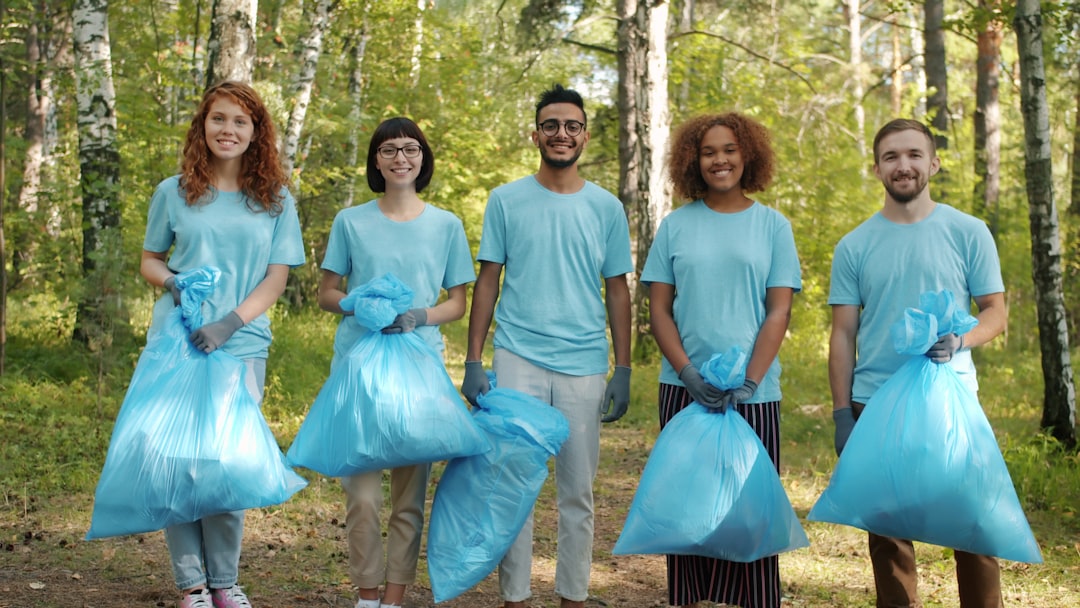 Group of diverse people wearing gender-neutral, minimalist activewear in neutral tones