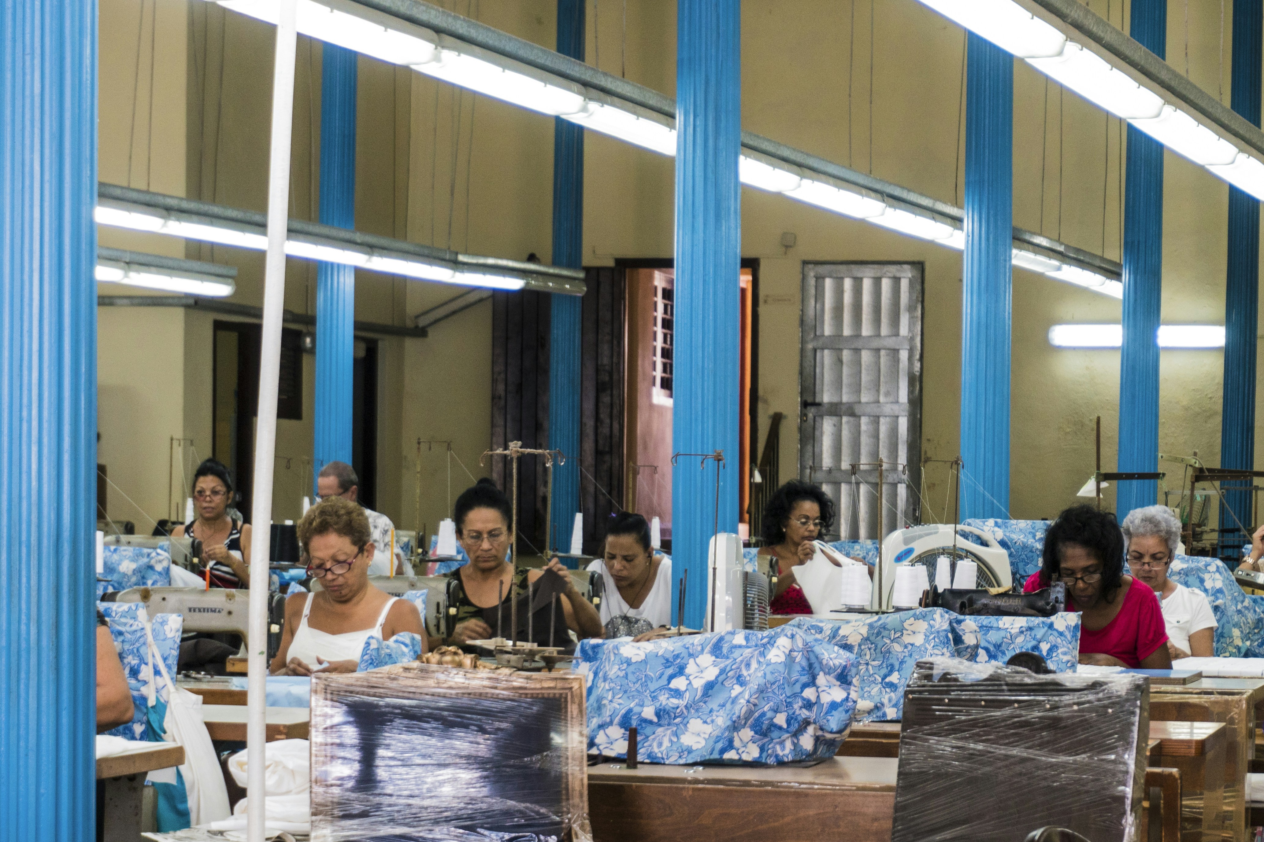 A diverse group of garment workers in a clean and safe factory environment