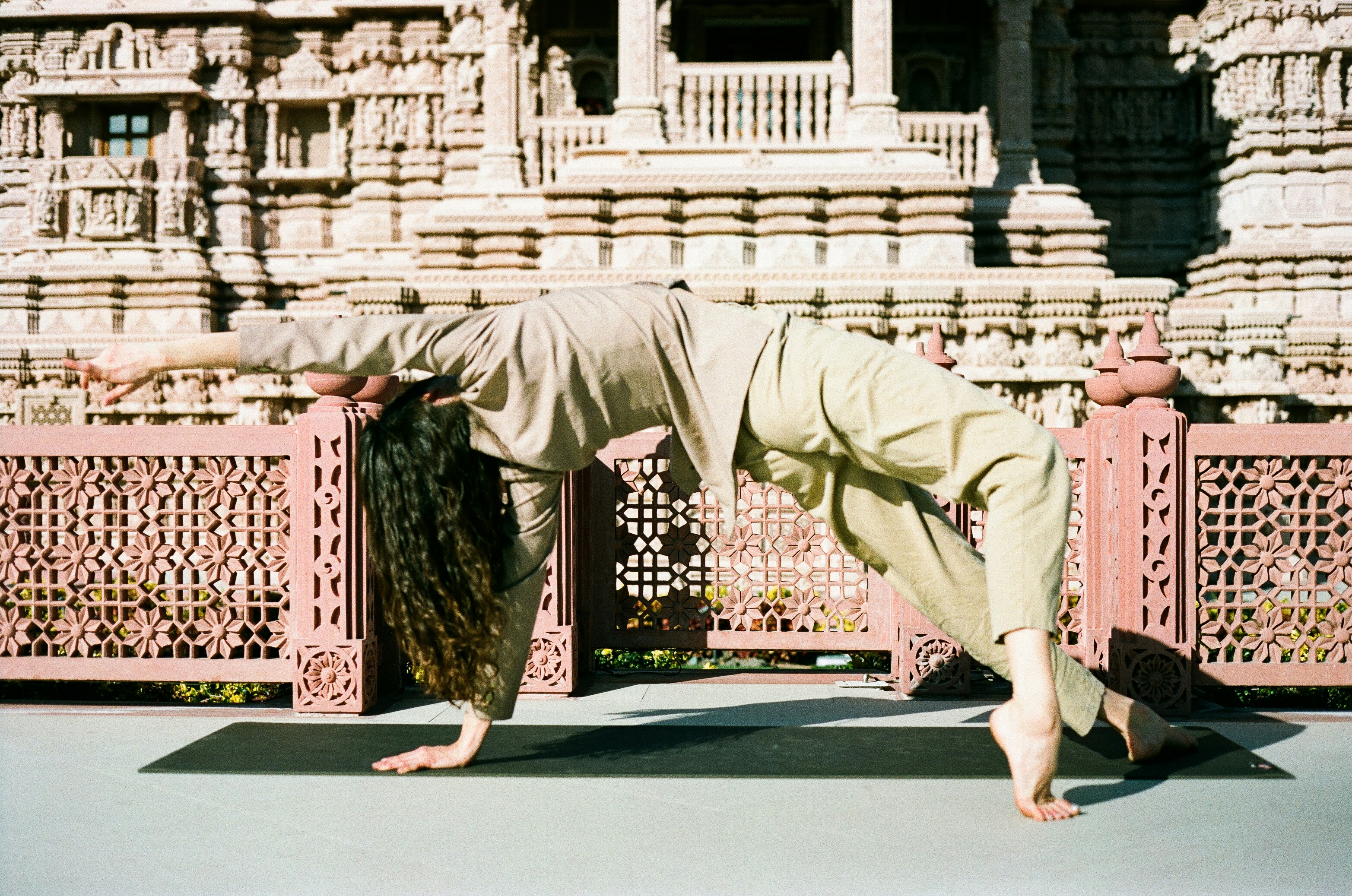 A person practicing yoga in leggings made of organic cotton.