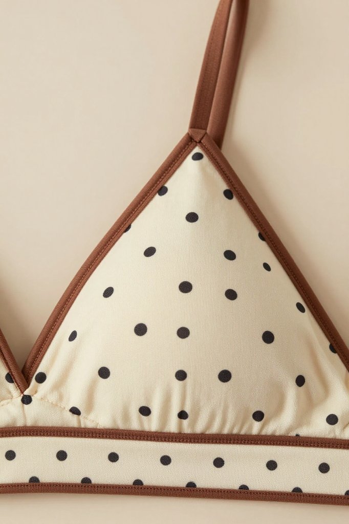 Triangle bralette close-up with adjustable straps and contrast trim
