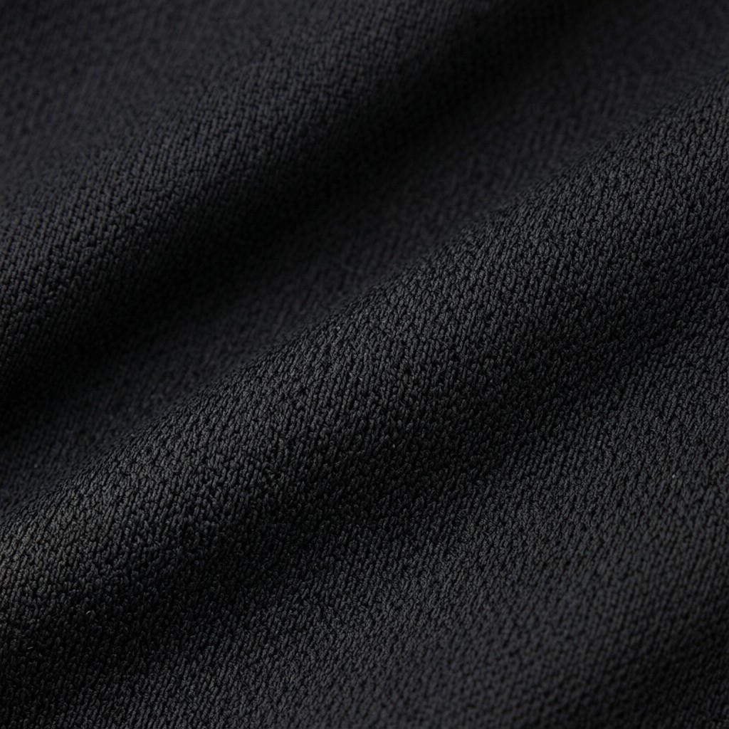 Yoga bra fabric texture macro detail showing moisture-wicking microfibre weave pattern