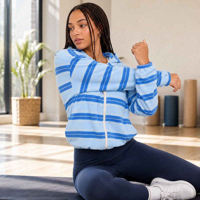 Wearing the jacket in a yoga studio