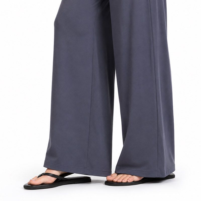 Full-length wide-leg trouser hem showing fluid drape on custom yoga pants