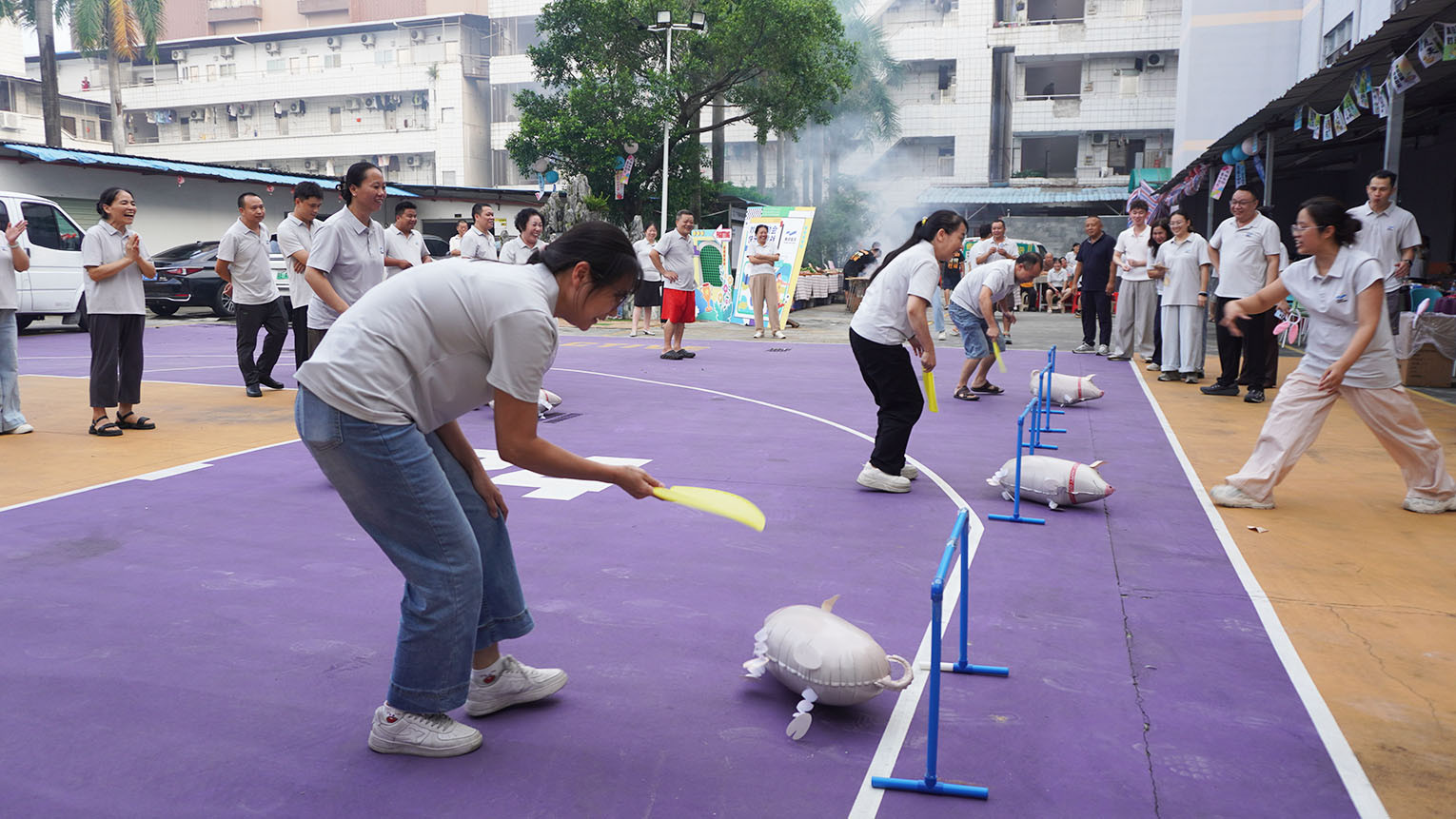 Bloomto team members participating in friendly sports activities and encouraging one another during the annual team day.