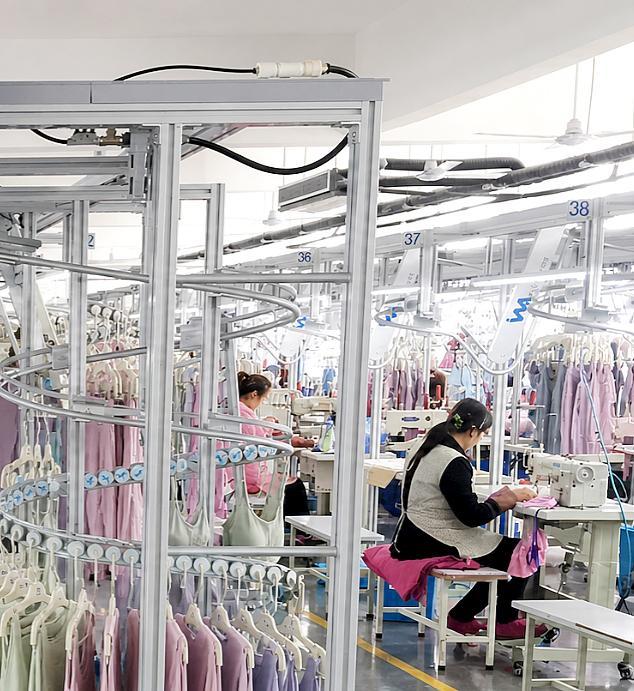 Activewear production team sewing private label garments