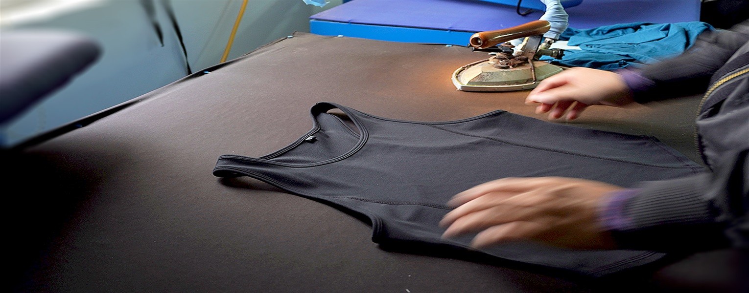 Activewear garment pressing and finishing process before final inspection and packing