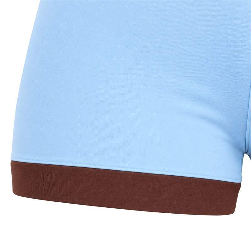 Blue yoga set shorts with a brown contrast leg band and visible seam finish