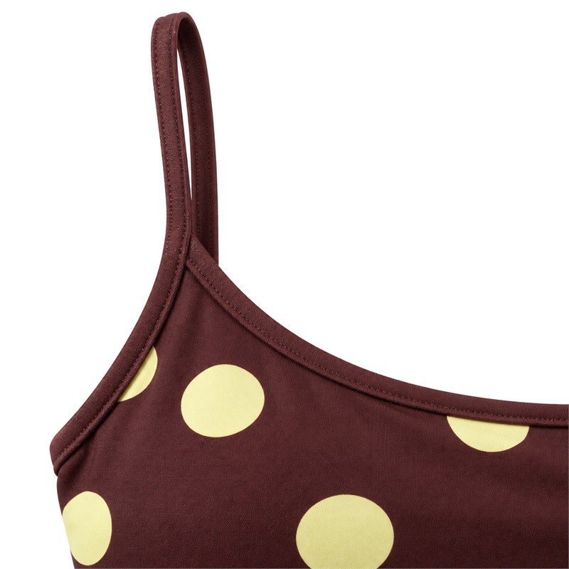 Narrow strap and bound scoop-neck edge on the polka-dot yoga set cami
