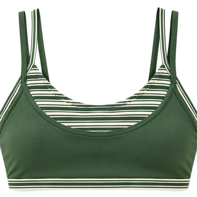 Layered sports bra double straps and striped inset above a solid green U-neck