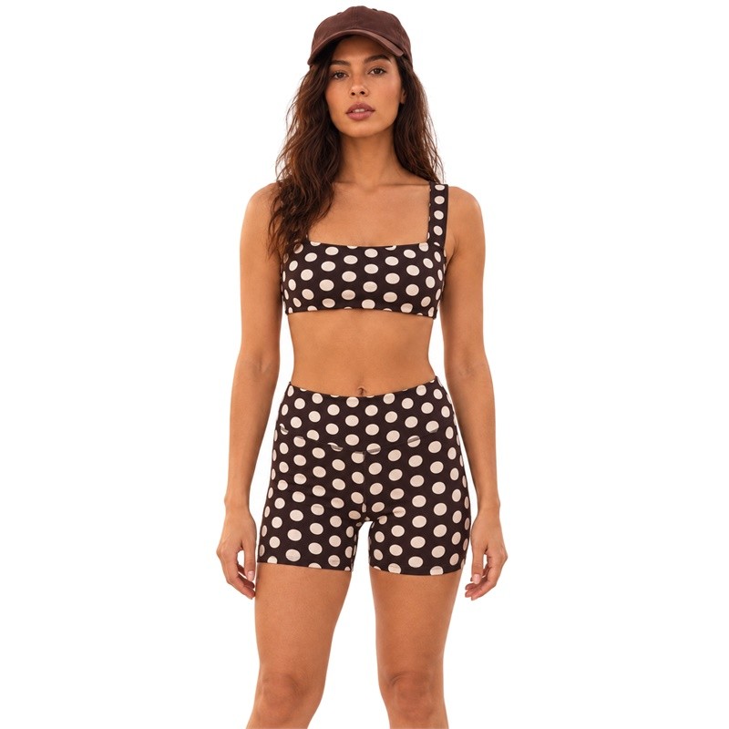 Front view of a brown polka dot square-neck crop top and matching high-waist shorts