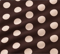 Close-up of cream-colored polka dots on a dark brown ground