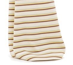 Close-up of a wide pant hem with narrow brown green and yellow stripes on a cream base