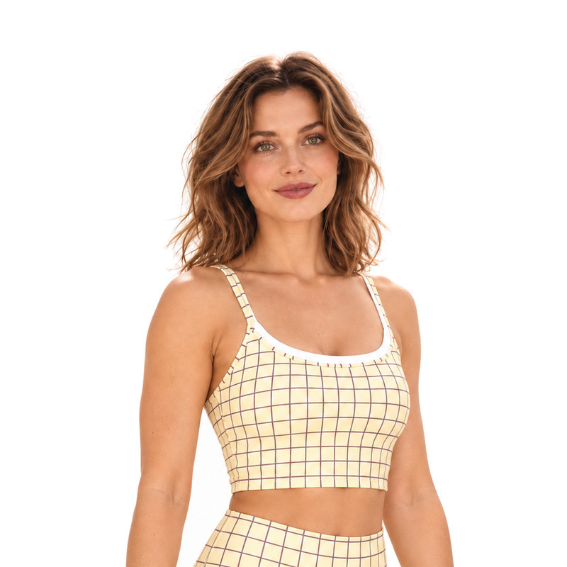 Three-quarter view of the cropped grid print yoga bra and slim shoulder straps