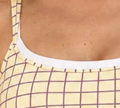 Close-up of the square neckline binding and grid print shoulder strap
